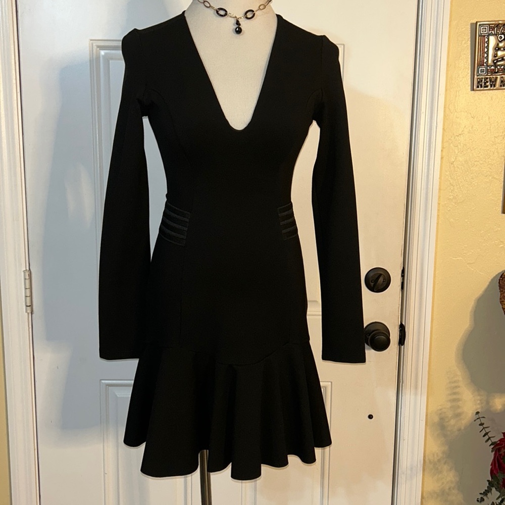 Morena Rosa Stunning and sophisticated little black dress. Flounce hem.